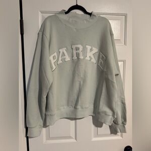 Parke Women's crew neck sweatshirt L/XL. New. Color something blue and white.
